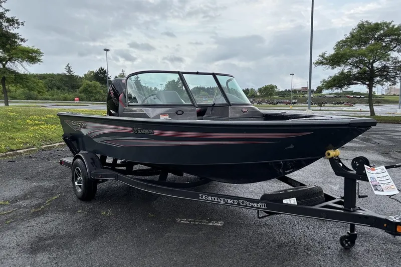 Slide: The Image of 2025 Ranger VS1682SC Angler boat on trailer in parking lot. - 3