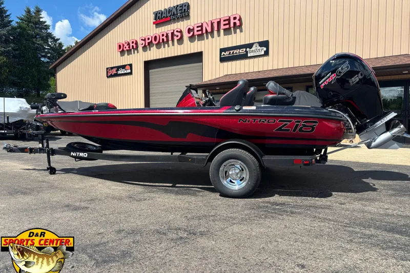 Slide: The Image of 2026 Nitro Z18 Pro boat at D&R Sports Center, featuring sleek red and black design. - 1