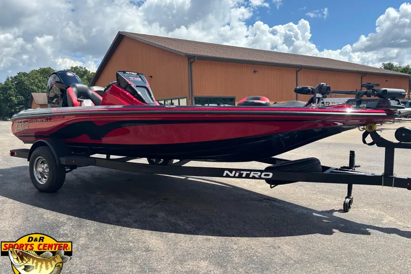 Slide: The Image of 2026 Nitro Z18 Pro boat on trailer, red and black design, parked outdoors. - 3