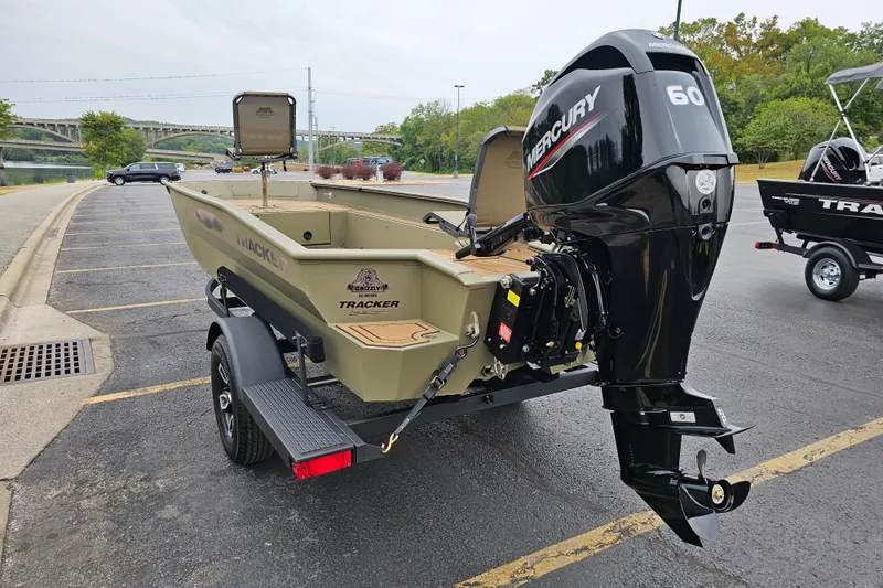 Slide: The Image of 2026 Tracker Grizzly 1650 T Prairie Wings Edition boat with Mercury 60 engine in parking lot. - 4