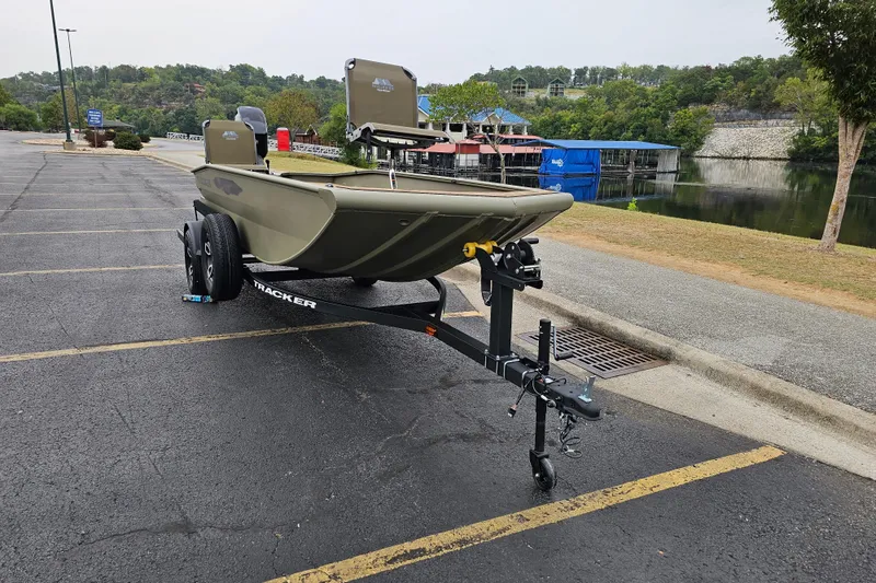 Slide: The Image of 2026 Tracker Grizzly 1650 T Prairie Wings Edition boat on trailer in parking lot. - 5
