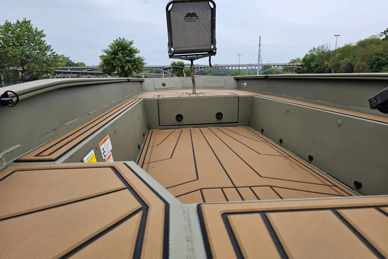 Slide: The Image of 2026 Tracker Grizzly 1650 T Prairie Wings Edition boat interior with spacious deck. - 6