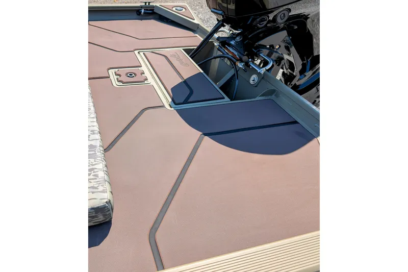 Slide: The Image of 2026 Tracker Grizzly 1860 CC boat deck with modern design and storage compartments. - 8