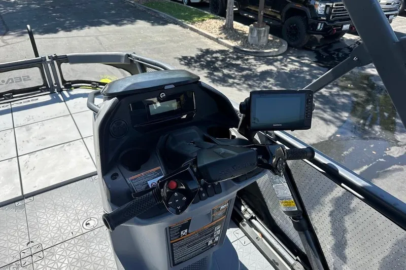 Slide: The Image of 2024 Sea-Doo Switch Sport 18 dashboard with controls and navigation display. - 16