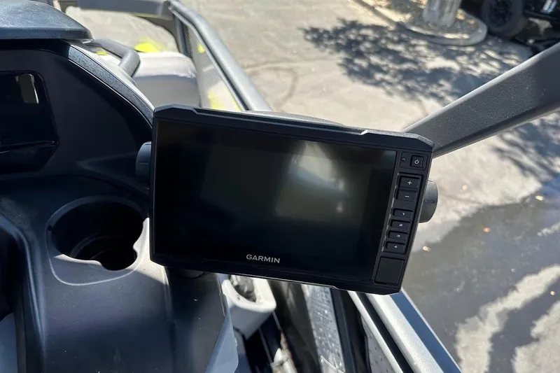 Slide: The Image of Garmin display on 2024 Sea-Doo Switch Sport 18 dashboard, featuring control buttons. - 18