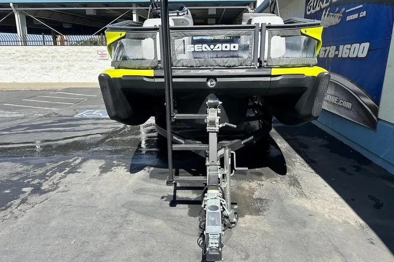 Slide: The Image of 2024 Sea-Doo Switch Sport 18 on trailer, parked outdoors. - 4