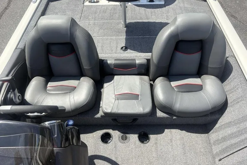 Slide: The Image of 2026 Tracker Pro Team 190 TX boat interior with gray leather seats and red accents. - 15