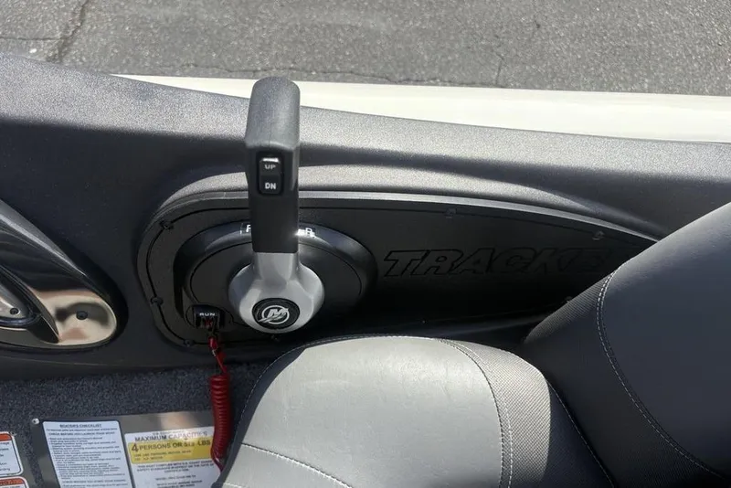 Slide: The Image of 2026 Tracker Pro Team 190 TX boat throttle control and seat detail. - 24