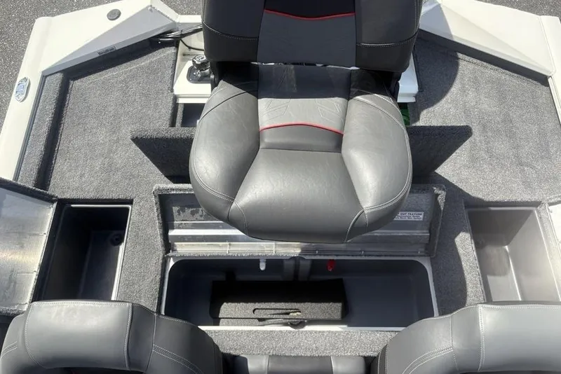 Slide: The Image of 2026 Tracker Pro Team 190 TX boat interior with gray seating and storage compartments. - 26