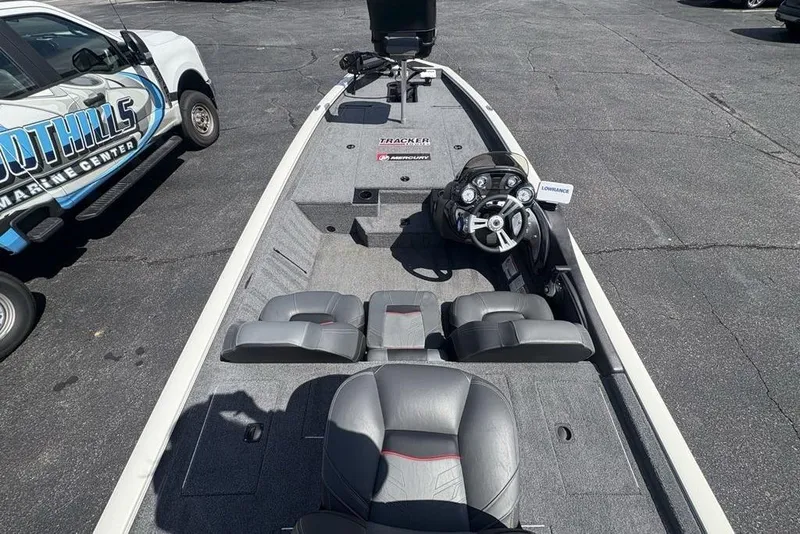 Slide: The Image of 2026 Tracker Pro Team 190 TX boat interior with steering console and seating. - 29