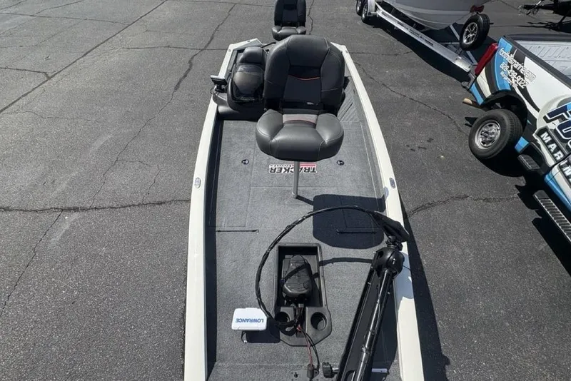 Slide: The Image of 2026 Tracker Pro Team 190 TX fishing boat on pavement, featuring seating and equipment. - 30