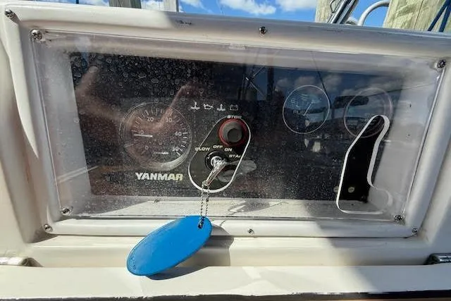 Slide: The Image of Control panel of a 2005 Hunter 38 sailboat with Yanmar engine display. - 17