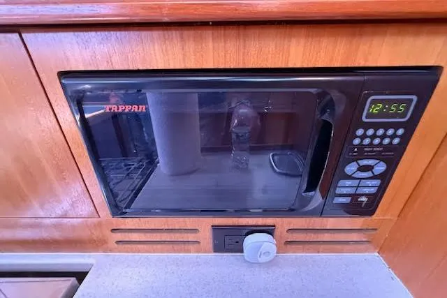 Slide: The Image of Built-in Tappan microwave in 2005 Hunter 38 yacht kitchen, featuring digital controls. - 42