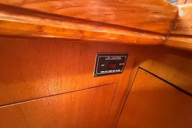 Slide: The Image of LPG control panel on 2005 Hunter 38 boat with wooden interior. - 43