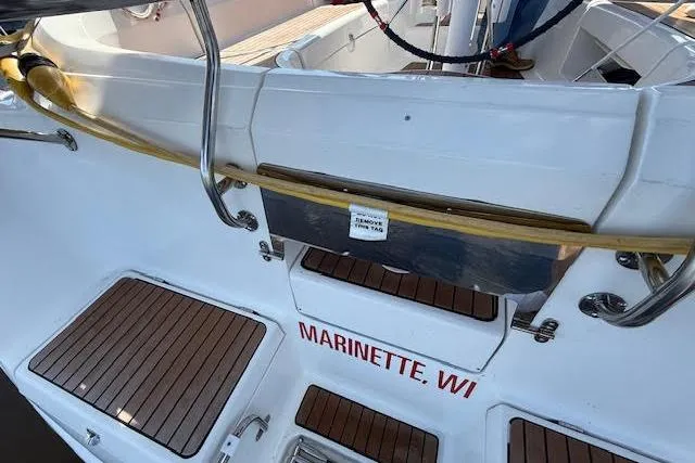 Slide: The Image of 2005 Hunter 38 sailboat deck with teak flooring, docked in Marinette, WI. - 8