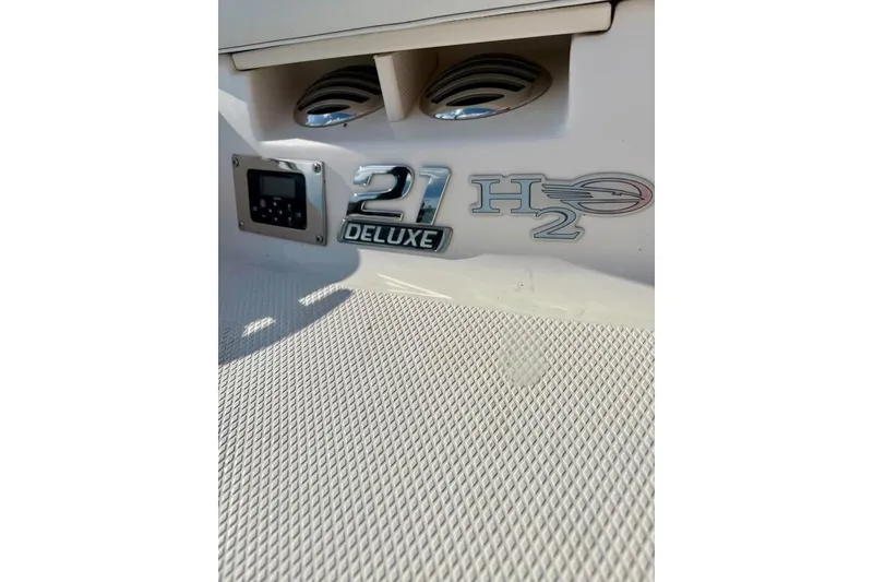 Slide: The Image of 2017 Chaparral 21 H2O Sport boat emblem and speaker detail. - 11