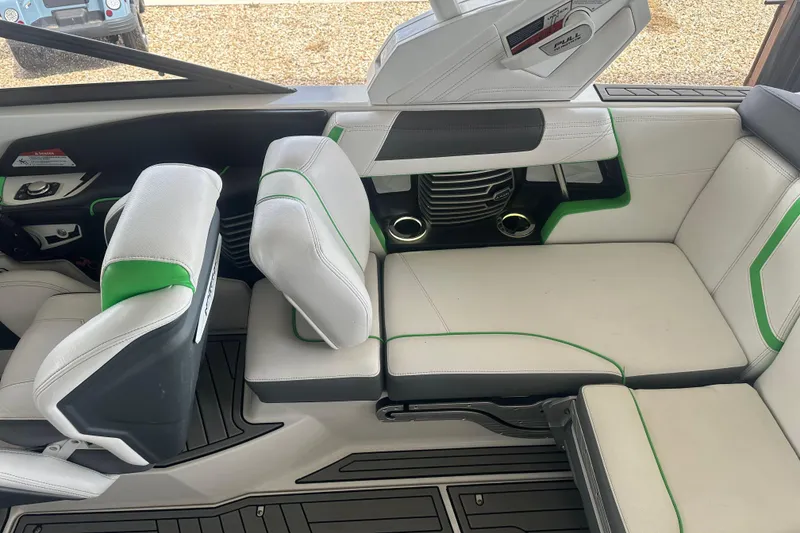 Slide: The Image of 2017 Nautique Super Air Nautique G21 interior with white and green seating. - 11