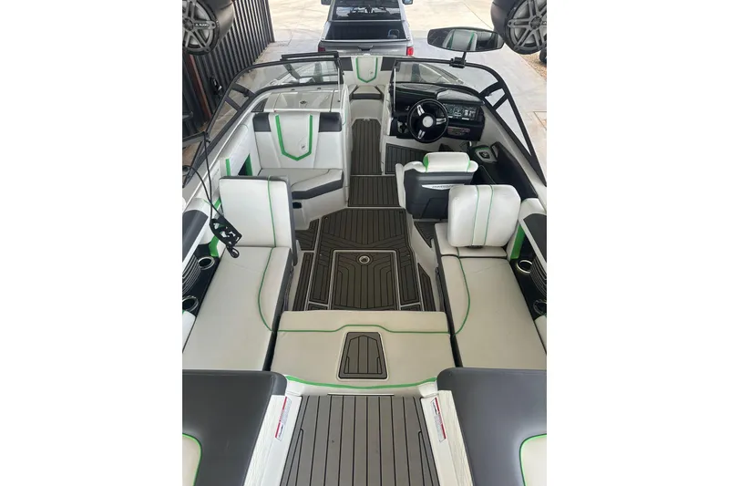 Slide: The Image of 2017 Nautique Super Air Nautique G21 interior with sleek seating and modern dashboard. - 13