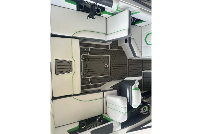 Slide: The Image of 2017 Nautique Super Air Nautique G21 interior with white and green seating. - 14