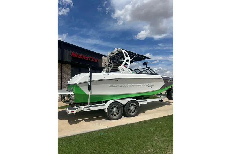 Slide: The Image of 2017 Nautique Super Air Nautique G21 boat on trailer, parked outside MasterCraft building. - 3