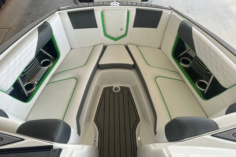 Slide: The Image of 2017 Nautique Super Air Nautique G21 boat interior with white and green seating. - 6