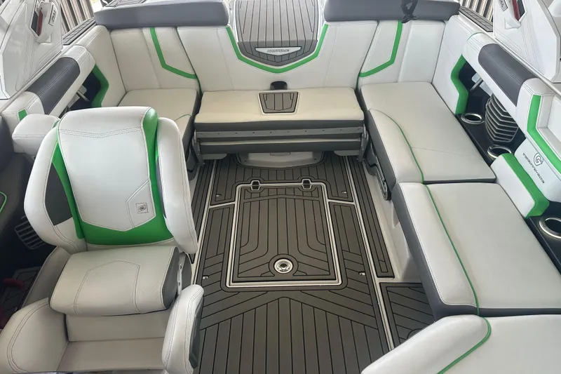 Slide: The Image of 2017 Nautique Super Air Nautique G21 interior with white and green seating, sleek design. - 8