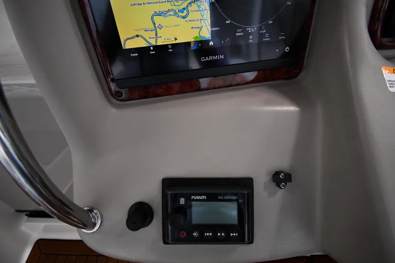 Slide: The Image of Dashboard of 2008 Sea Ray 340 Sundancer with Garmin navigation and Fusion audio system. - 14