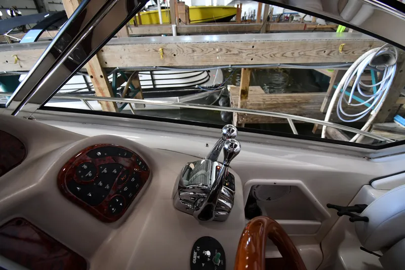Slide: The Image of Interior view of 2008 Sea Ray 340 Sundancer boat controls and dashboard. - 17