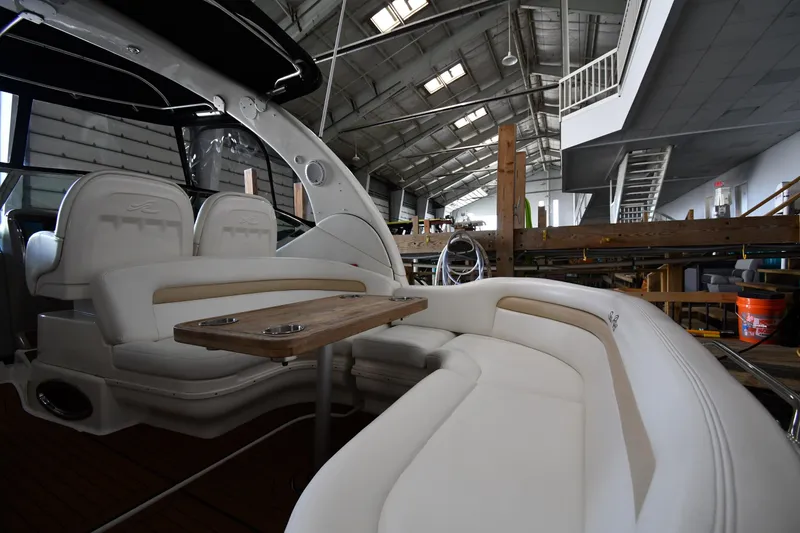 Slide: The Image of Interior of 2008 Sea Ray 340 Sundancer yacht with plush seating and wooden table. - 19