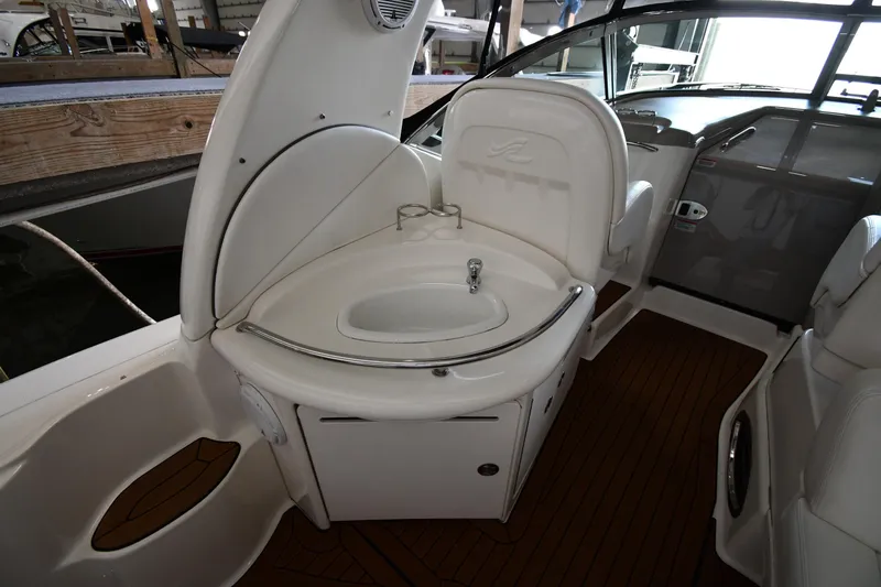 Slide: The Image of 2008 Sea Ray 340 Sundancer interior with sink and seating area. - 23