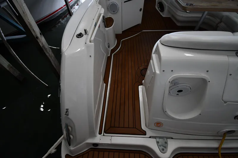 Slide: The Image of 2008 Sea Ray 340 Sundancer boat interior with teak flooring and seating area. - 27
