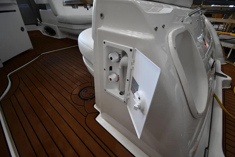 Slide: The Image of 2008 Sea Ray 340 Sundancer boat interior with teak flooring and control panel. - 28