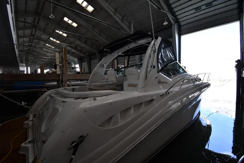 Slide: The Image of 2008 Sea Ray 340 Sundancer yacht docked in a spacious indoor marina. - 3