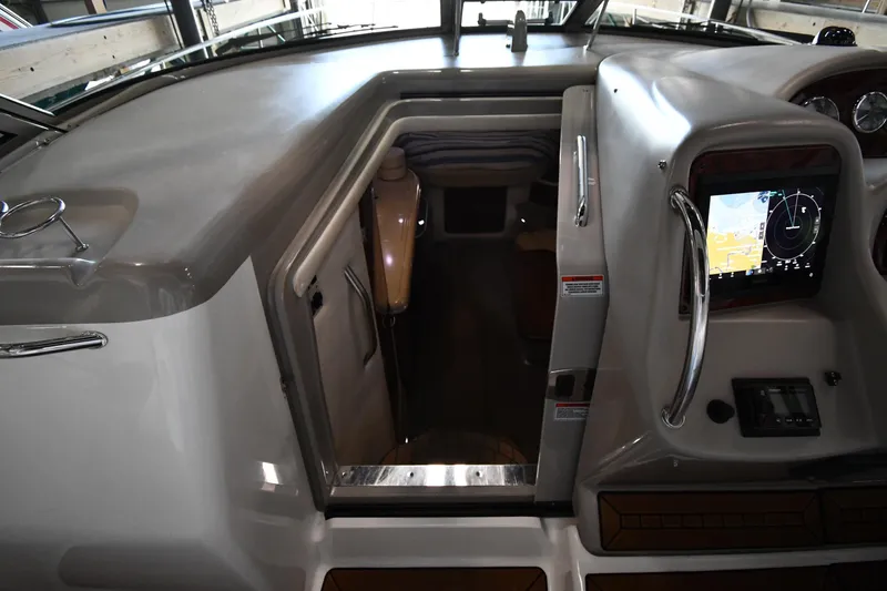 Slide: The Image of 2008 Sea Ray 340 Sundancer cockpit with navigation display and cabin entrance. - 30
