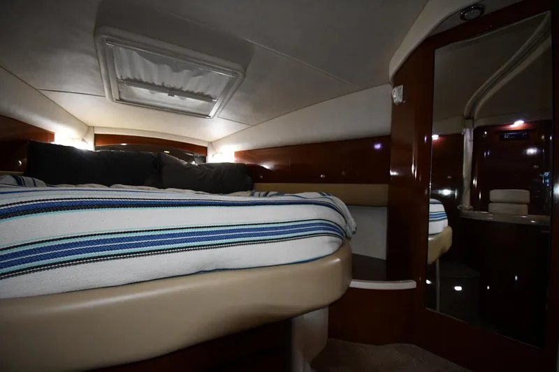Slide: The Image of Luxurious cabin interior of 2008 Sea Ray 340 Sundancer with striped bedding. - 32