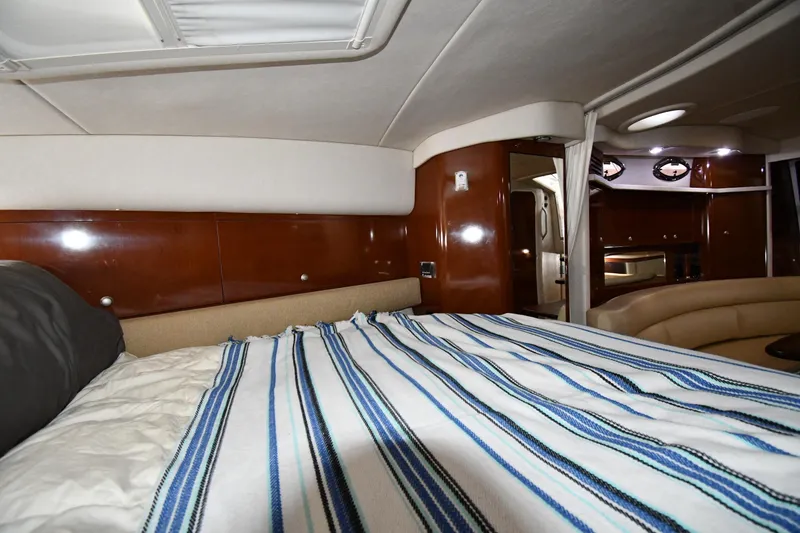Slide: The Image of Luxurious interior of 2008 Sea Ray 340 Sundancer yacht with cozy bed and elegant wood finish. - 35