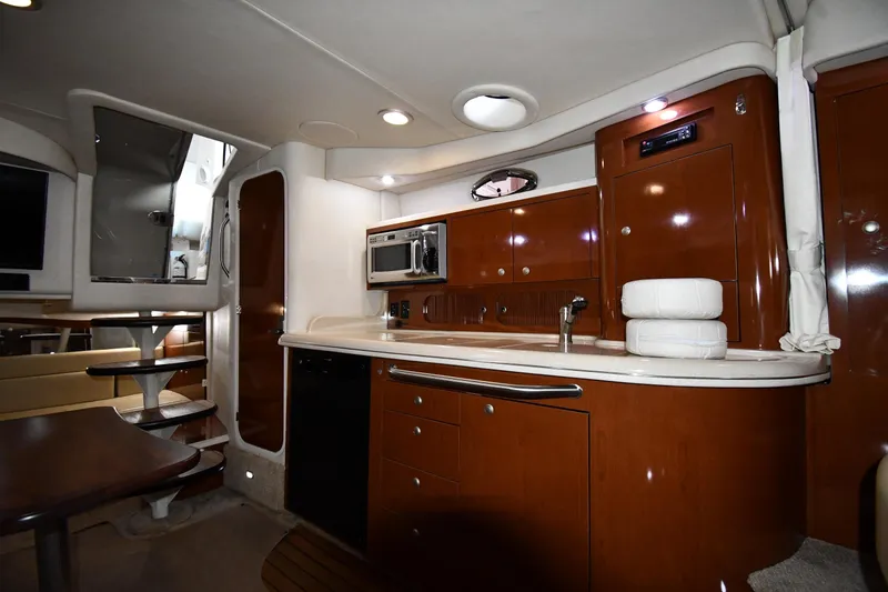 Slide: The Image of Interior of 2008 Sea Ray 340 Sundancer yacht with modern kitchen and seating area. - 38
