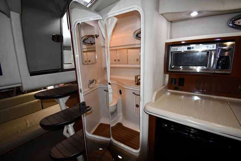 Slide: The Image of Interior of 2008 Sea Ray 340 Sundancer yacht with kitchenette and bathroom. - 43