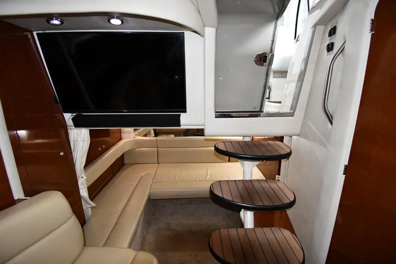 Slide: The Image of Luxurious interior of 2008 Sea Ray 340 Sundancer yacht with TV and seating area. - 45