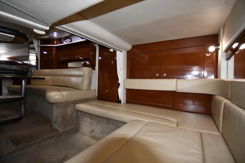 Slide: The Image of Interior of 2008 Sea Ray 340 Sundancer yacht with beige seating and wooden cabinetry. - 46