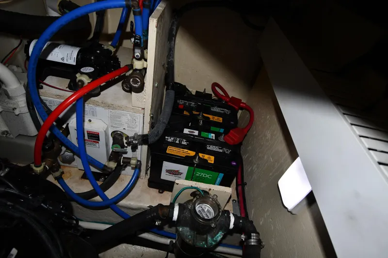 Slide: The Image of Engine compartment of 2008 Sea Ray 340 Sundancer with batteries and wiring. - 55