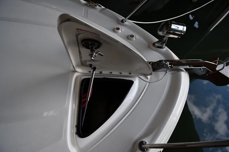 Slide: The Image of 2008 Sea Ray 340 Sundancer anchor locker with open hatch and stainless steel fittings. - 6