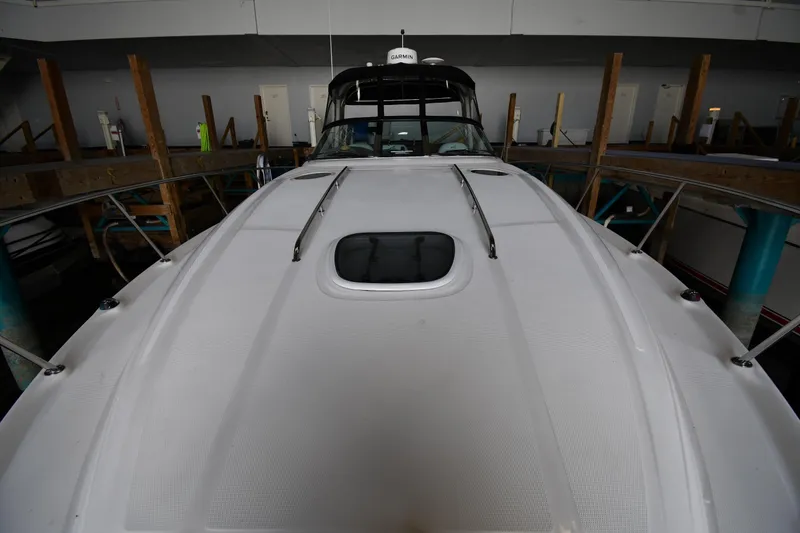 Slide: The Image of 2008 Sea Ray 340 Sundancer yacht in storage, viewed from the bow. - 7