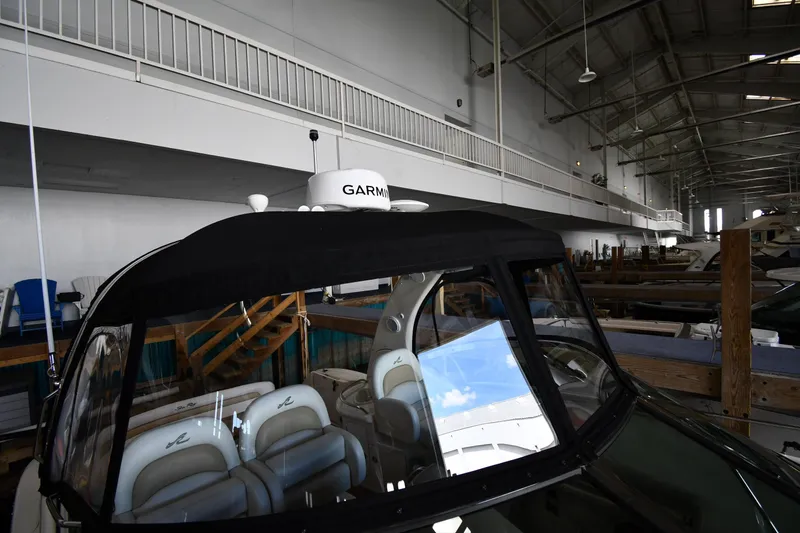 Slide: The Image of 2008 Sea Ray 340 Sundancer yacht in indoor storage with Garmin equipment. - 9