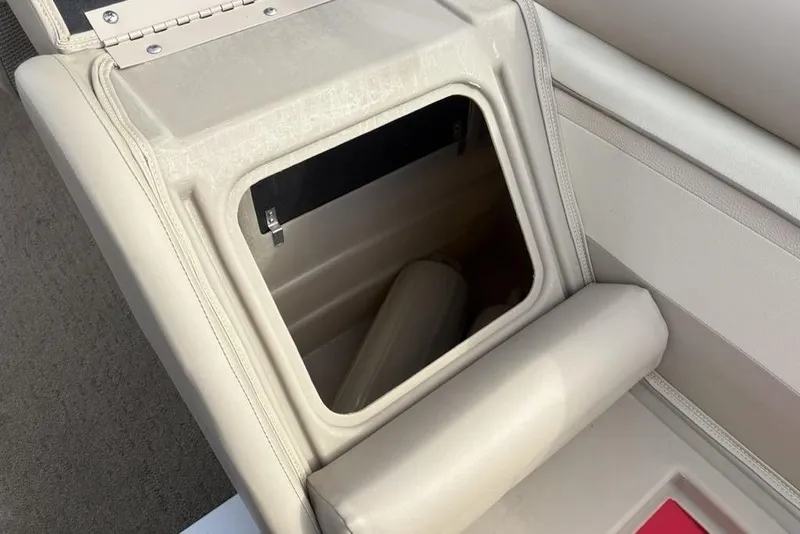 Slide: The Image of Open storage compartment in 2015 Bennington 24 SSRX boat seat. - 28