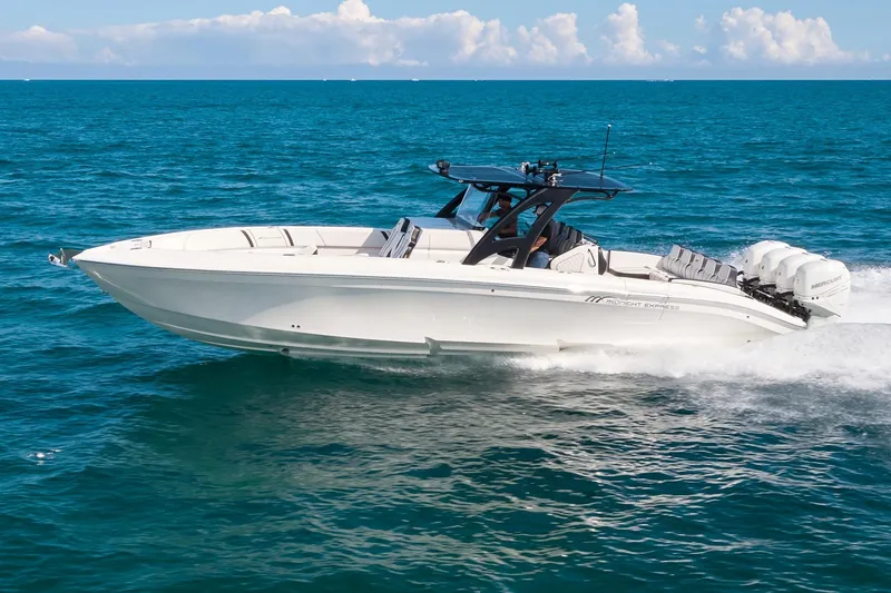 The Image of 2020 Midnight Express 37' Open boat cruising on blue ocean waters. - 0