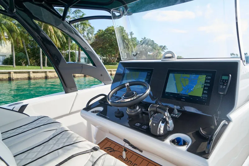 Slide: The Image of Cockpit of 2020 Midnight Express 37' Open boat with advanced navigation displays. - 11