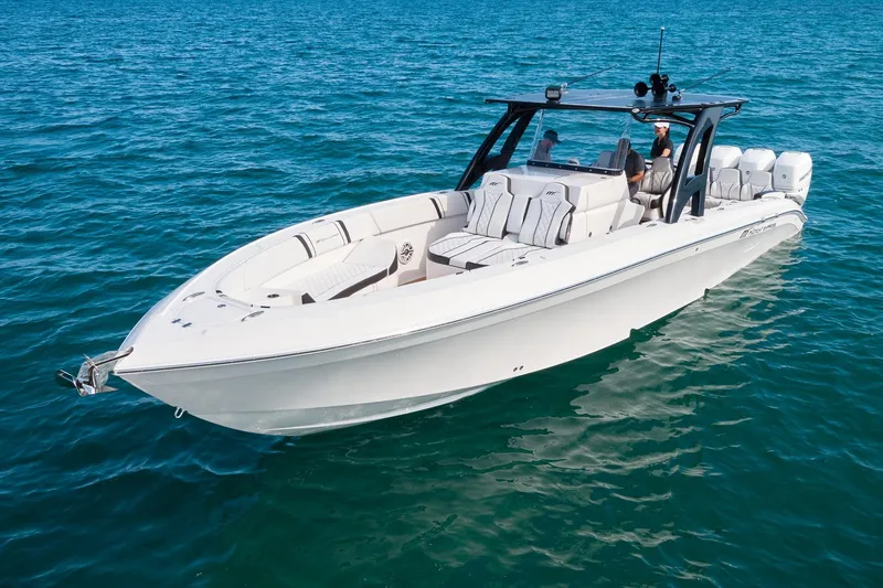 Slide: The Image of 2020 Midnight Express 37' Open boat cruising on clear blue water. - 5