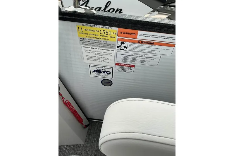 Slide: The Image of 2023 Crest Classic LX 220 capacity label, showing maximum 11 persons or 1551 lbs. - 4