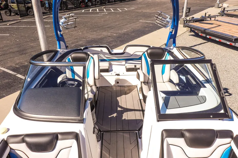 Slide: The Image of 2019 Yamaha Boats 212X interior with sleek seating and modern design. - 10